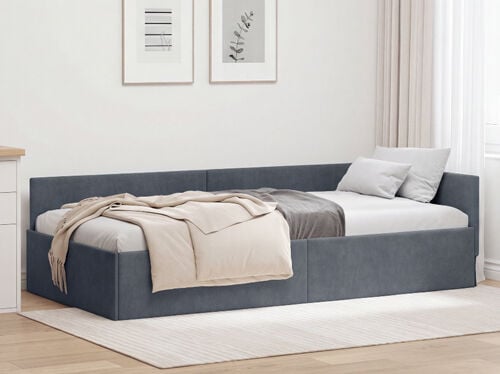 Modern grey upholstered daybed with bedding and cushions in a bright bedroom. Click to see the products in the collection.