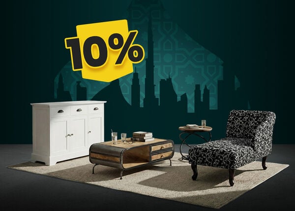 White sideboard, wooden coffee table with a metal frame, and a black and white floral chaise longue on a woven rug, with a city skyline backdrop, and a 10% yellow discount tag.